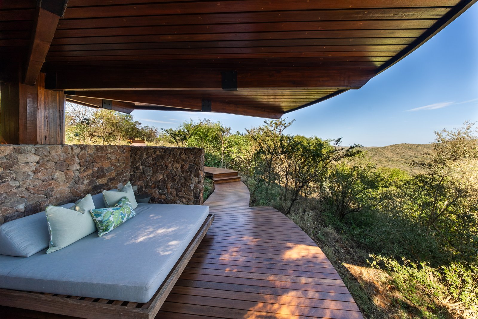 Shaded sala daybed set into the bush